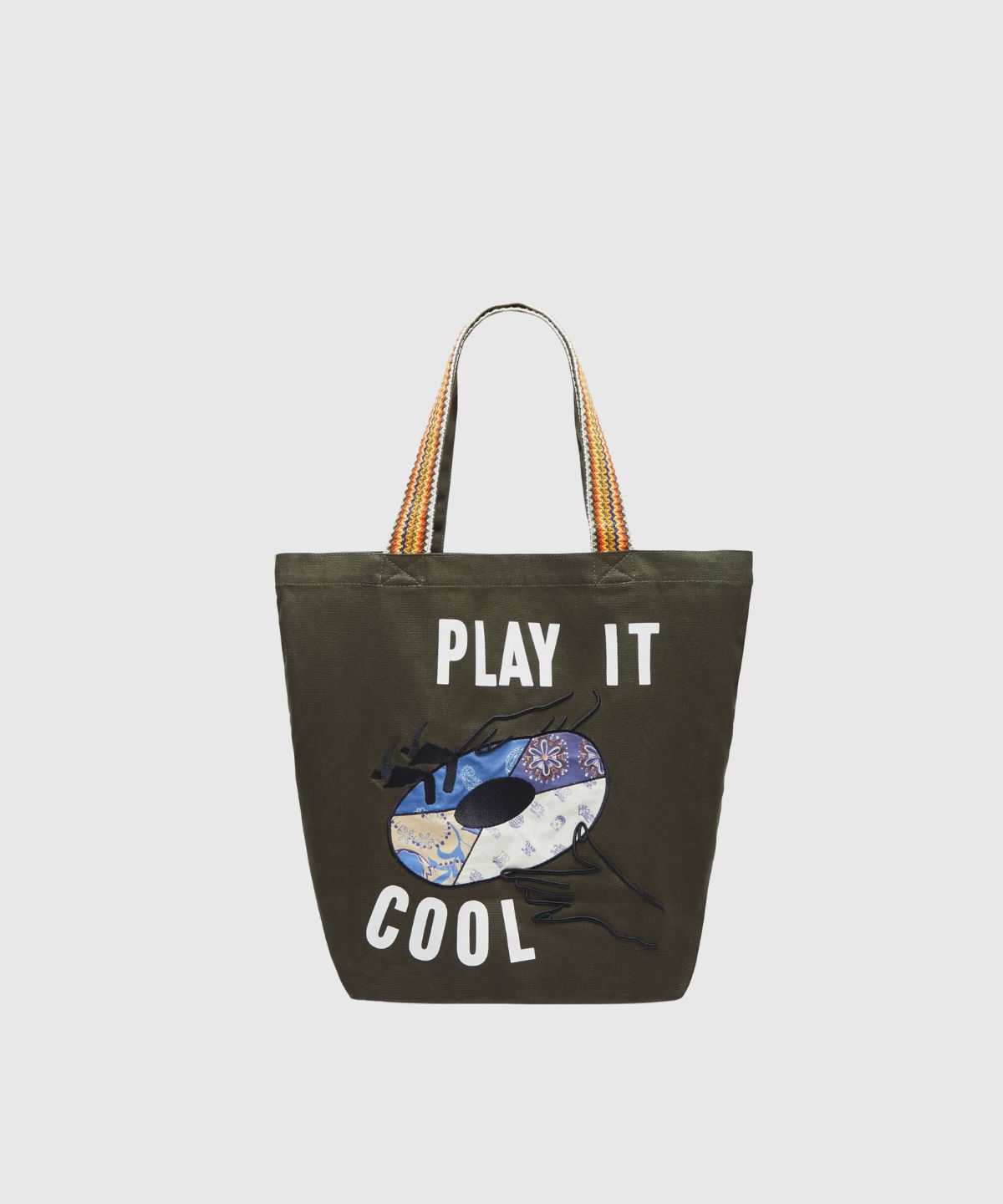 Canvas tote with patched-on artwork